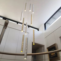 Thumbnail for Modern minimalist linear cylinder pendant with silver shooting star design and perforated tubes for staircase illumination