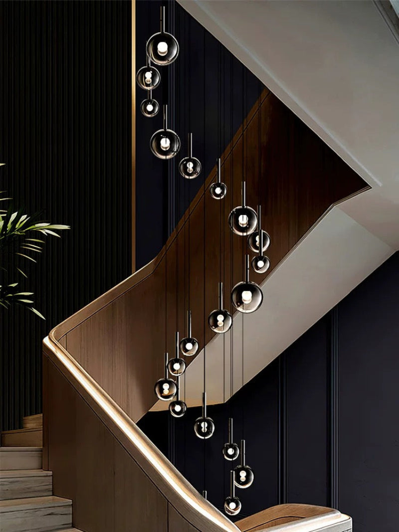 Clear blown glass ombre bubble pendant, gradient black globes in mixed sizes for staircase foyer high ceiling