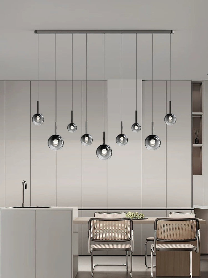 Luxurious gradient-colored glass pendant light, suitable for dining room islands.