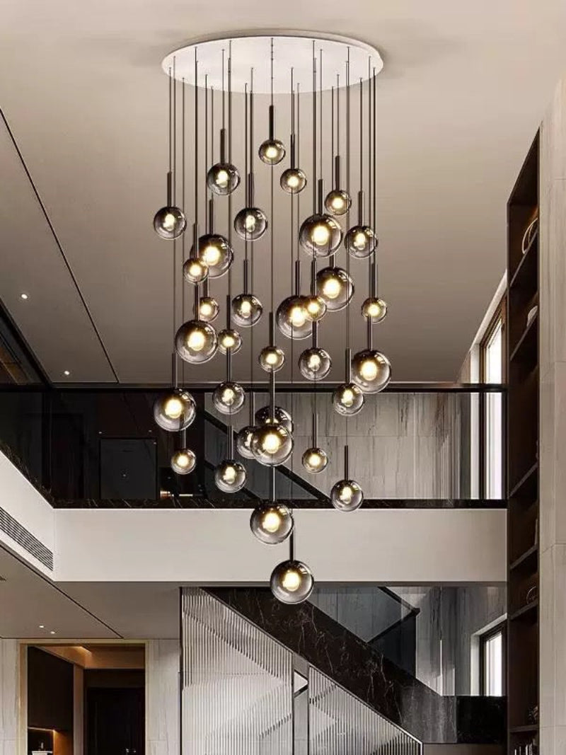 Modern ombre glass chandelier for foyer, gradient black globes cascading down staircase for two-story high ceiling
