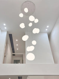 Thumbnail for Shimmering stellar stones chandelier with celestial orbs creating mesmerizing light diffusion for stairwell foyer entryway