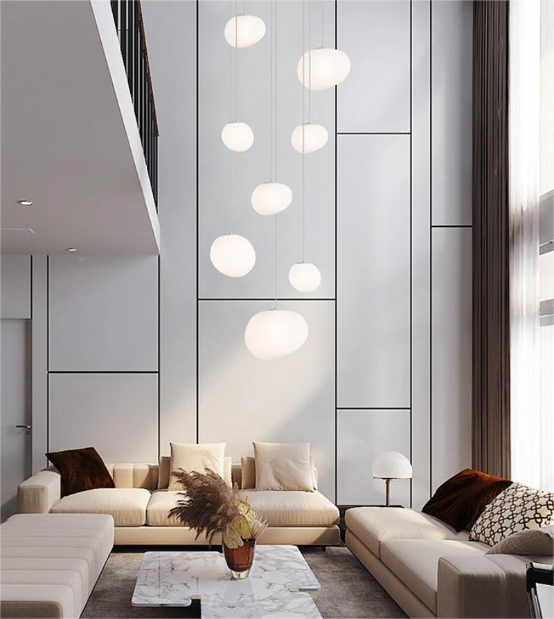 Contemporary LED stellar pendant featuring white acrylic spheres in constellation pattern for stairwell two-story atrium