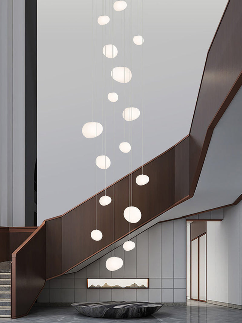 Stylish stellar stones pendant featuring radiant celestial spheres in organic arrangement for staircase foyer high ceiling