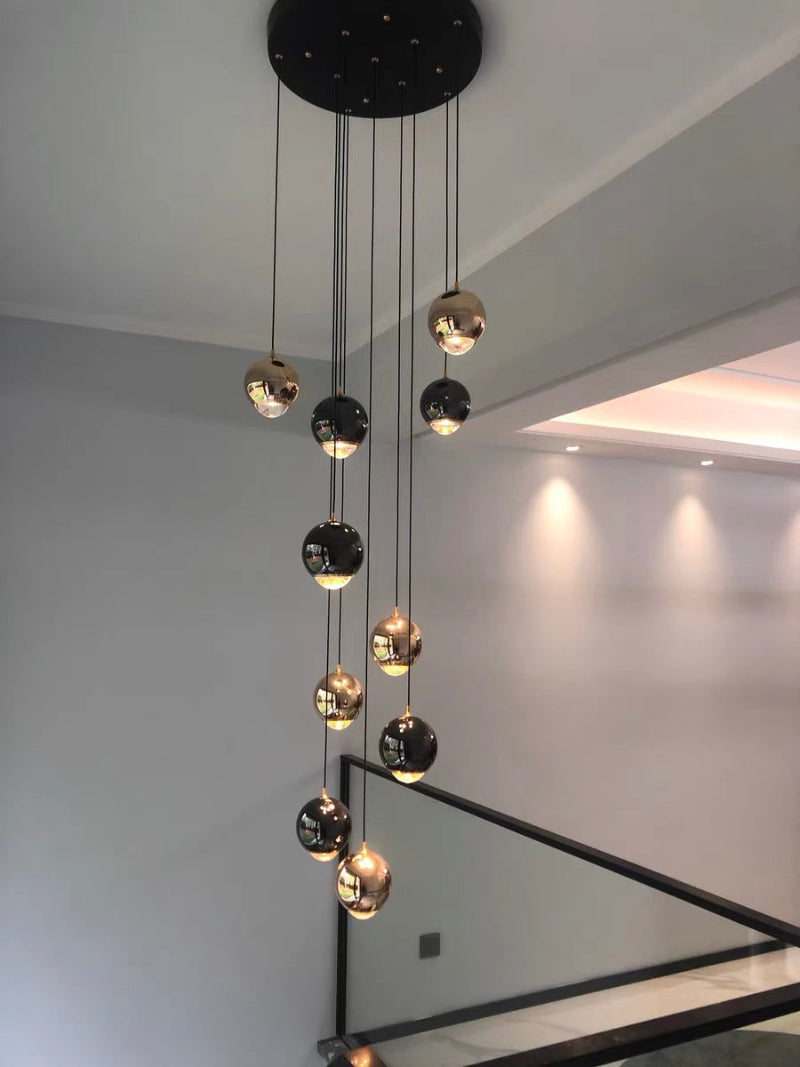 Staircase chandelier featuring hand-assembled cognac glass truffle spheres with K9 crystal for foyer entryway high ceiling
