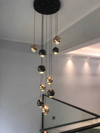 Thumbnail for Staircase chandelier featuring hand-assembled cognac glass truffle spheres with K9 crystal for foyer entryway high ceiling