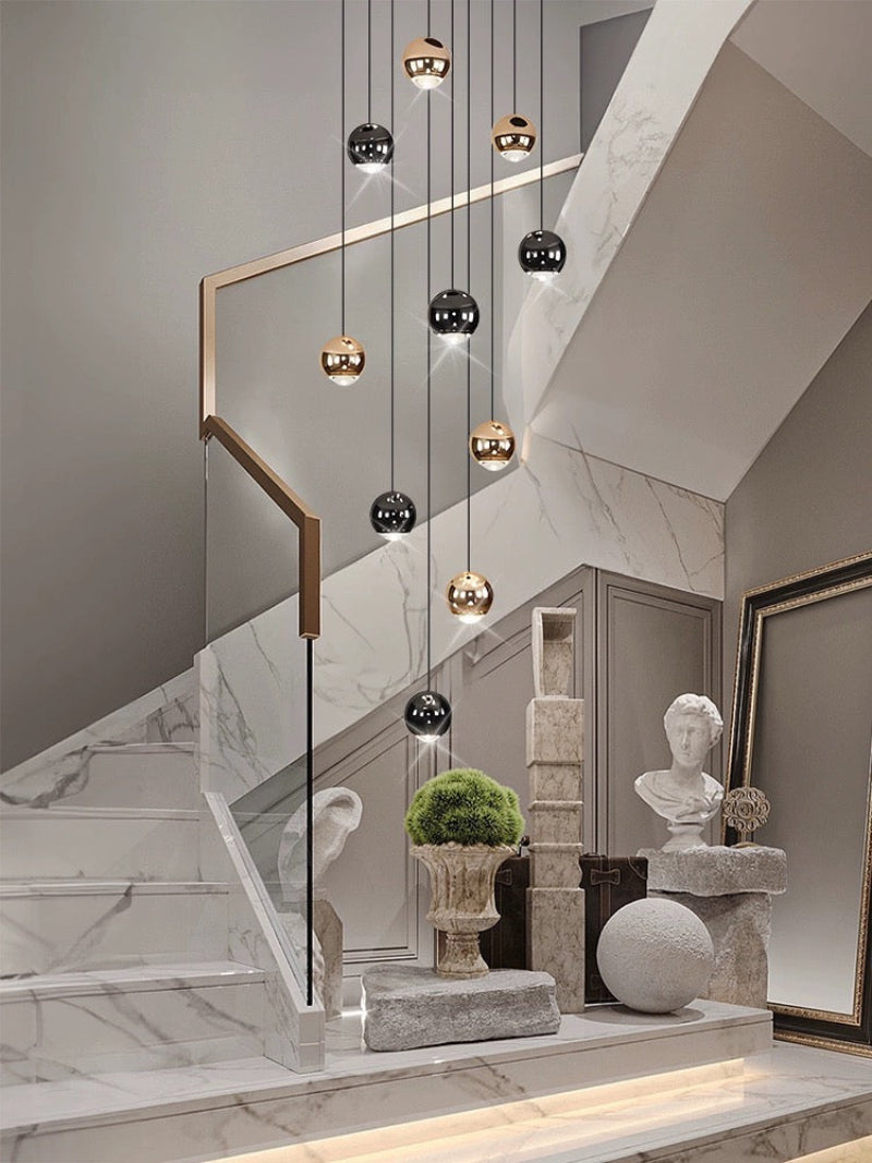 Gold cognac glass chandelier featuring artisan truffle-inspired spheres with aluminum construction for foyer entryway lighting