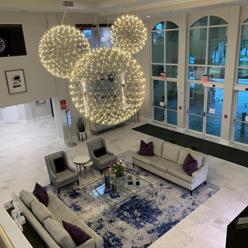 Chrome-plated firework starburst chandelier with LED dandelion design, suitable for foyers, entryways, and double-height ceilings. UL certified product.