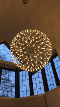 Thumbnail for Modern chrome-plated LED chandelier with a starburst dandelion design, suitable for high-ceiling lighting areas such as foyers and entryways.