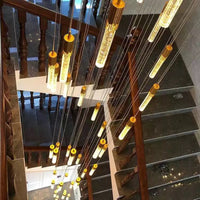 Thumbnail for Unique long crystal chandelier for high ceiling featuring Celestial Rain meteor shower spiral with 3D bubbles for staircase foyer