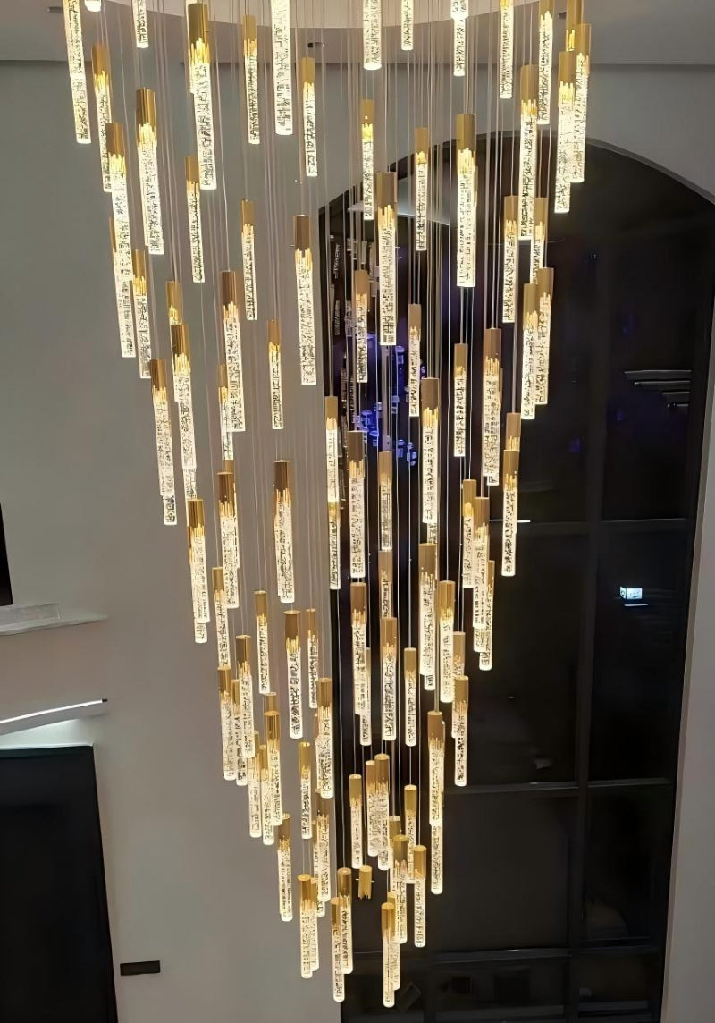 Long meteor shower crystal pendant with Celestial Rain spiral cascade design featuring 3D bubbles for staircase high ceiling foyer