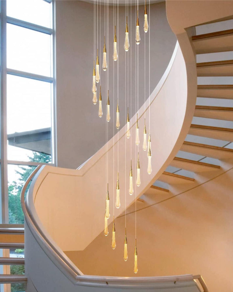 Crystal raindrop chandelier, champagne rain illuminating staircase foyer with timeless beauty and gold powder