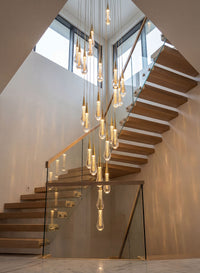 Thumbnail for Sophisticated Champagne Rain crystal raindrop chandelier with spiral design creating dramatic visual impact in contemporary high ceiling foyer