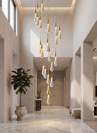 Thumbnail for Designer Champagne Rain crystal raindrop chandelier with spiral arrangement creating dramatic lighting installation in contemporary stairwell void