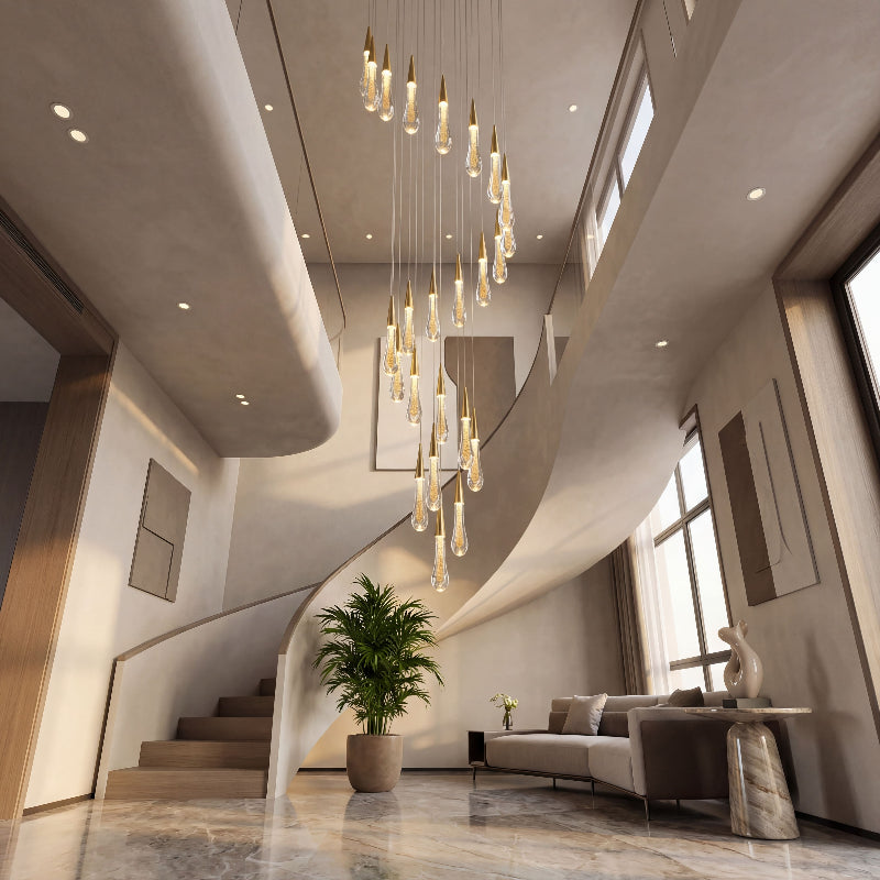 Bespoke Champagne Rain crystal raindrop chandelier with custom cluster creating brilliant ambient lighting in luxury two-story foyer stairwell