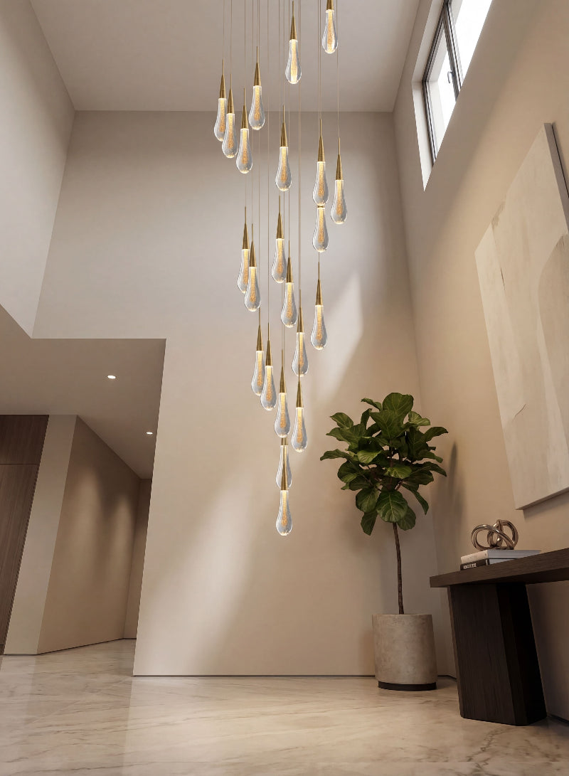 Contemporary Champagne Rain crystal raindrop chandelier with custom cluster design creating cascading lighting in modern two-story foyer staircase