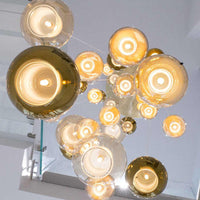 Thumbnail for Glass bubble pendant lights for restaurants, and artistic glass sphere lamps in various colors and sizes for staircases, foyers, and high-ceiling lighting.