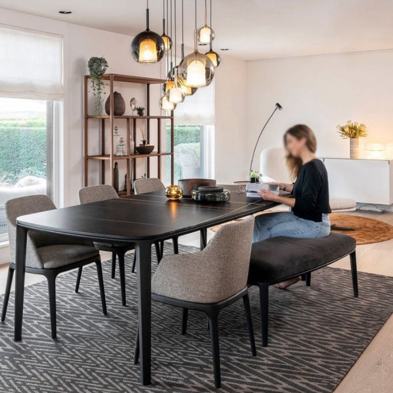 Luxurious multi-colored art glass staircase chandelier with spherical lampshades of varying sizes. The randomly arranged design is suitable for placement above a dining table. UL certified, with adjustable suspension wires.