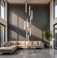 Thumbnail for Elegant tubular acrylic cascade chandelier with brass accents creating waterfall light sculpture in luxury staircase foyer two-story ceiling