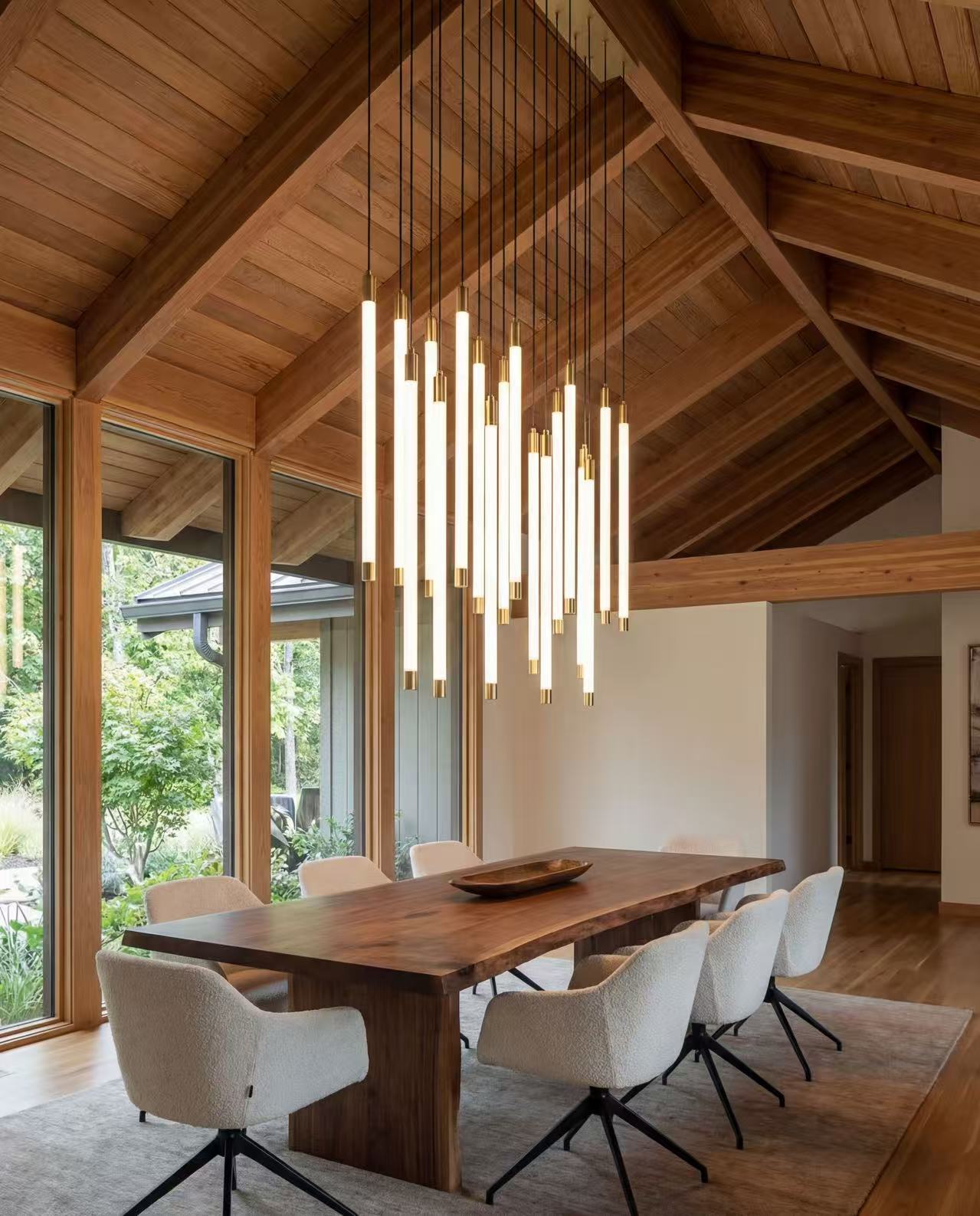 Statement cascade chandelier with luminous tubular acrylic design creating dramatic flowing effect in modern staircase foyer entryway lighting