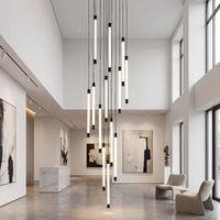 Thumbnail for Designer tubular acrylic cascade chandelier with brass finish creating sophisticated flowing light in modern staircase foyer two-story space