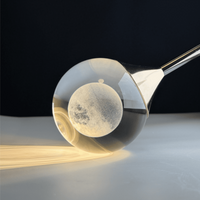 Thumbnail for Premium mosaic crystal chandelier, laser-engraved moon K9 spheres for foyer staircase entryway two-story ceiling,close-up shot with the lights on.