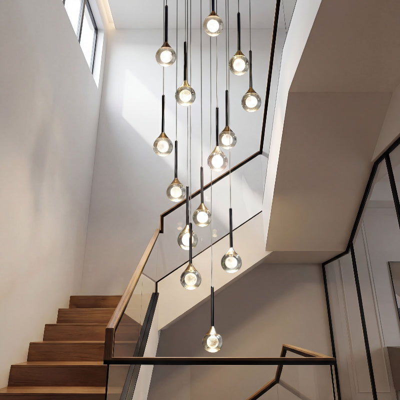 Contemporary Gemstone Cascade mosaic crystal chandelier with laser-engraved moon spheres creating cascading lighting in modern two-story foyer