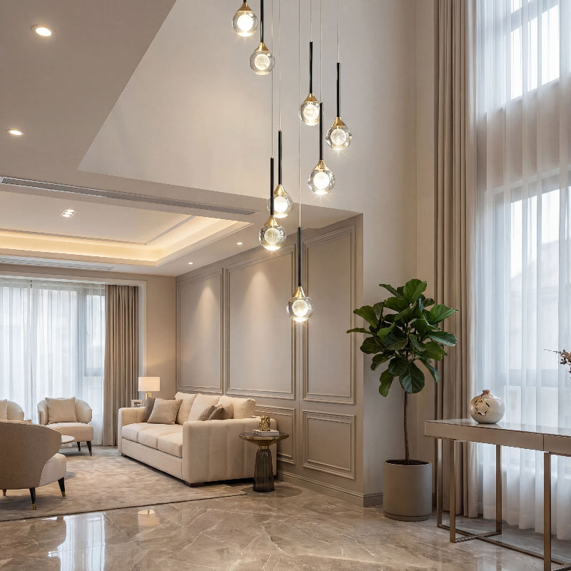 Bespoke Gemstone Cascade mosaic crystal chandelier with laser-engraved moon spheres creating brilliant light refraction in luxury foyer stairwell