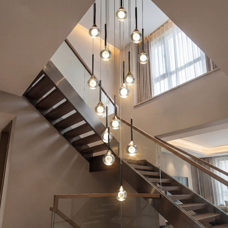 Artistic Gemstone Cascade mosaic crystal chandelier with laser-engraved moon spheres creating elegant ambient lighting in luxury residential foyer