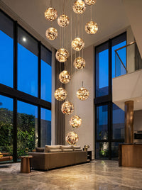 Thumbnail for Bespoke modern art firefly-inspired chandelier with glass spheres creating brilliant light refraction in luxury foyer stairwell