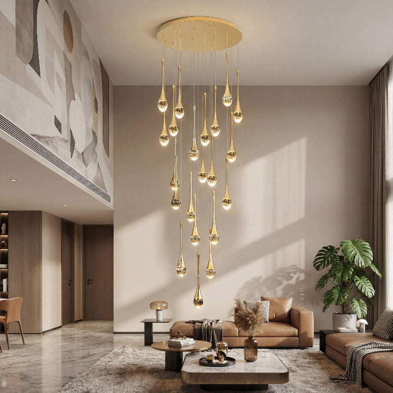 Luxury Golden Tears crystal teardrop chandelier cluster with internal bubble effects creating brilliant sparkle in contemporary residential entryway