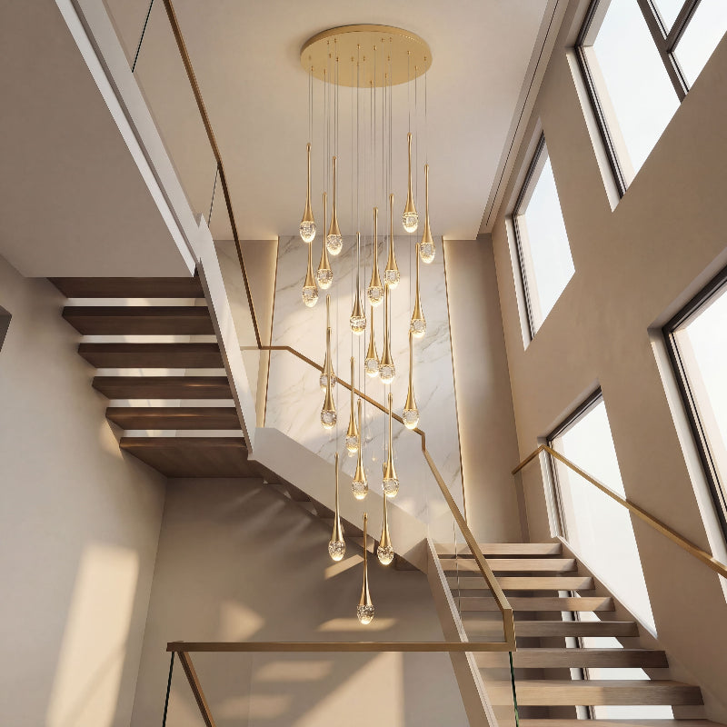 Statement gold Golden Tears crystal teardrop chandelier with solid crystal bubbles creating luxurious illumination in modern high ceiling entryway