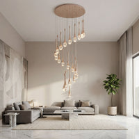 Thumbnail for Designer gold Golden Tears crystal teardrop chandelier with solid crystal bubbles creating elegant ambient lighting in modern stairwell void
