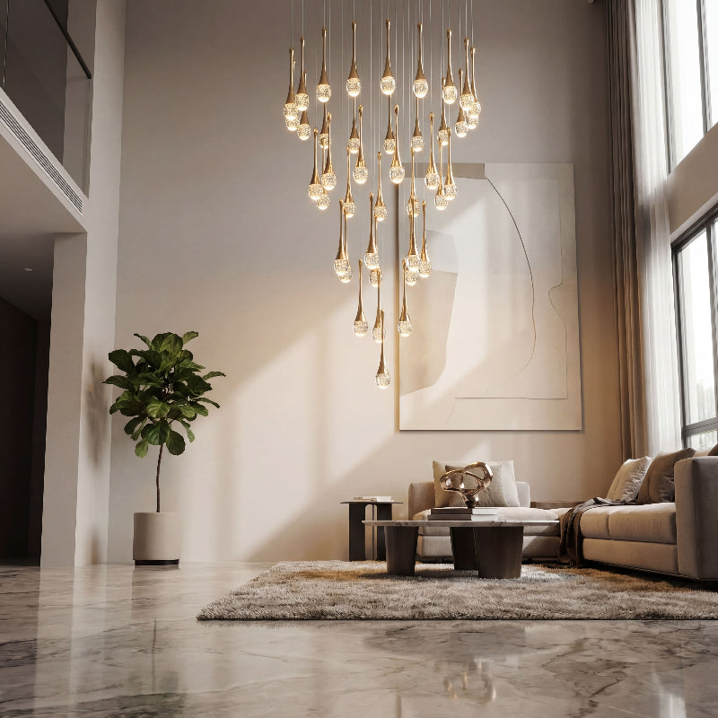 Premium Golden Tears crystal teardrop chandelier with internal bubble effects creating sophisticated ambient lighting in luxury residential staircase