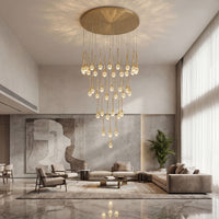 Thumbnail for Elegant gold Golden Tears crystal teardrop chandelier with solid crystal bubbles creating brilliant light refraction in contemporary foyer space