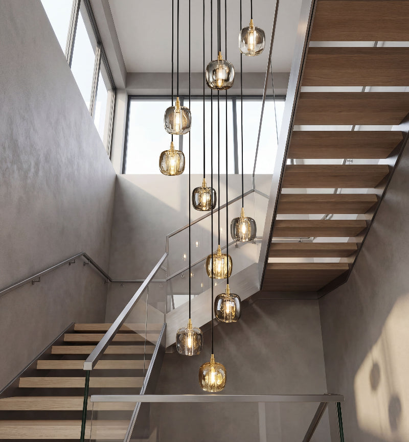 Luxury square crystal chandelier with helix spiral arrangement creating elegant focal point in modern two-story foyer entrance