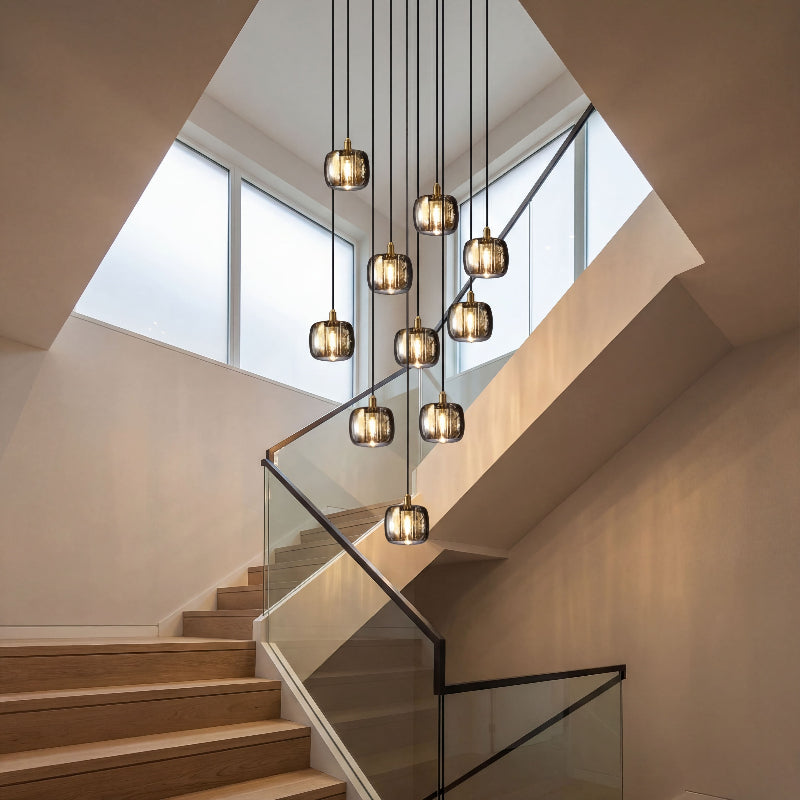 Modern cubic rain chandelier with transparent square crystals refracting light creating brilliant sparkle in grand entryway
