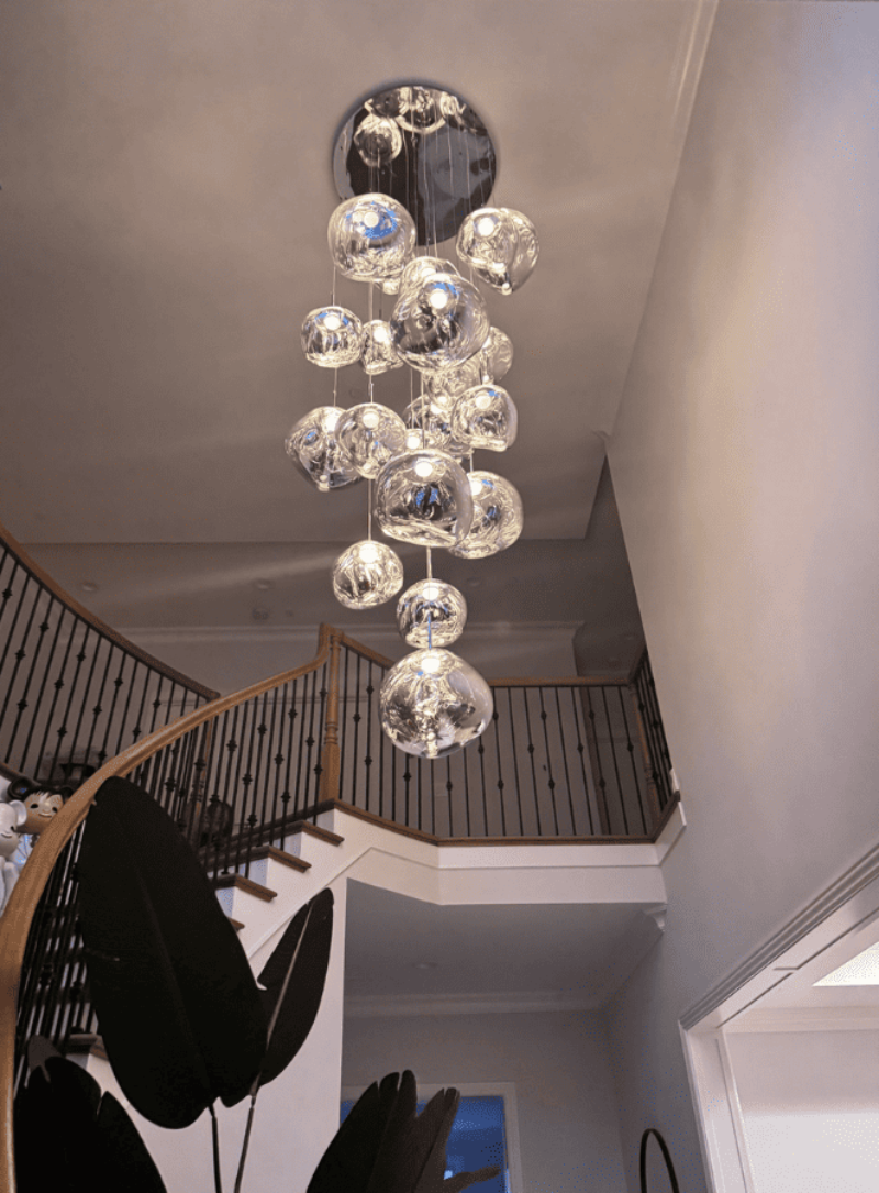 Modern lava bubble pendant light, featuring a molten glass design, suitable for staircases and living room lighting. Easy to install.