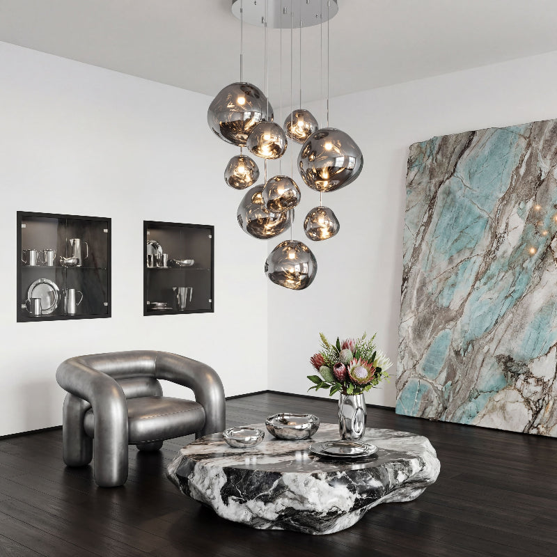 Designer Magma Flow lava bubble lighting fixture with flowing molten glass design creating artistic statement in modern foyer entryway