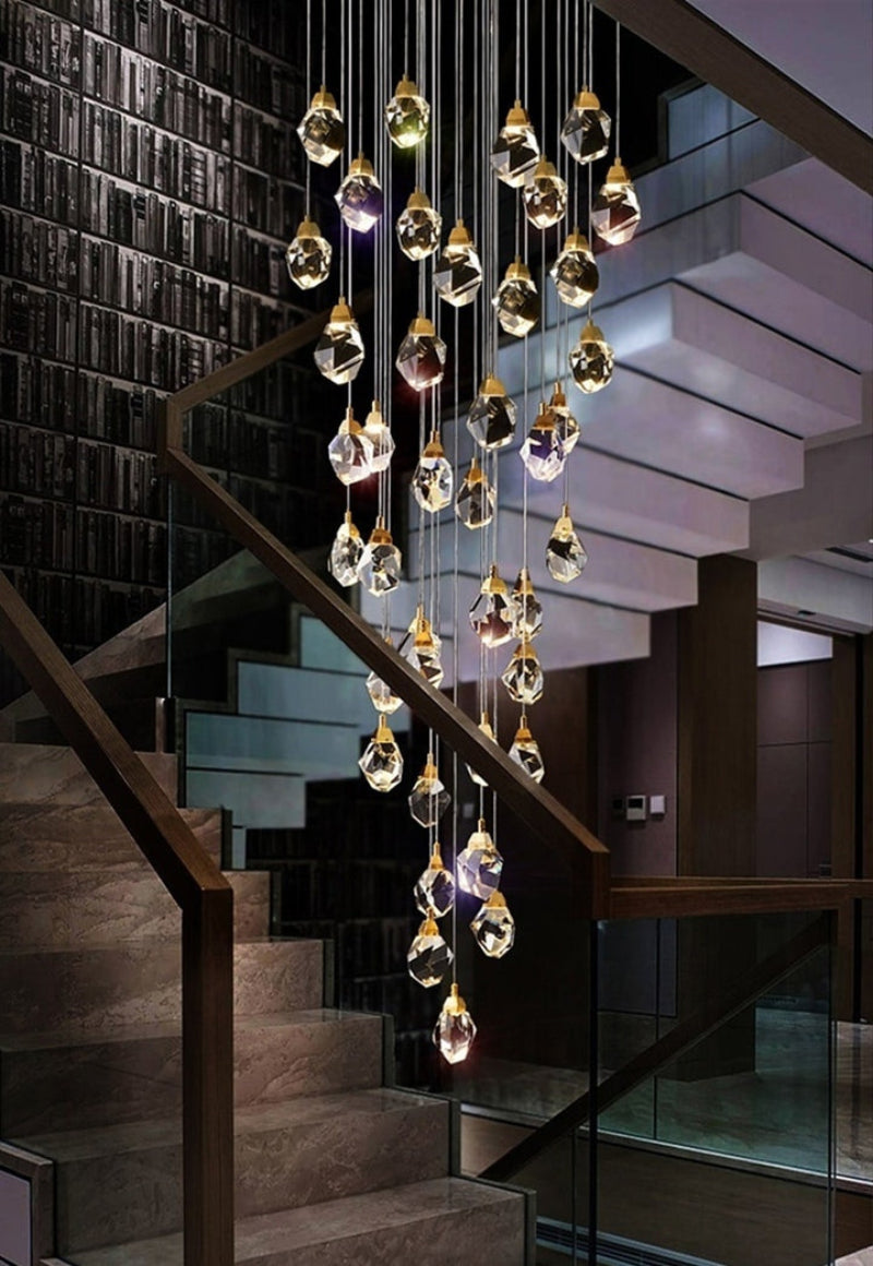 Modern foyer chandelier with irregular raw-cut crystals, brass finish for grand entryway staircase lighting