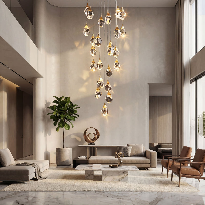 Modern irregular raw-cut crystal geode chandelier with natural brass creating sculptural lighting installation in grand stairwell void