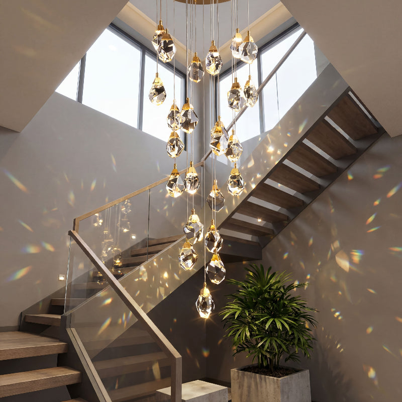 Designer Prism Geode chandelier featuring irregular raw-cut K9 crystals with natural brass finish for sophisticated staircase foyer