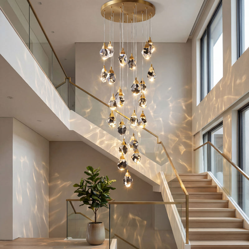 Luxury irregular raw-cut crystal geode chandelier with natural brass hardware creating dramatic prism lighting in two-story entryway