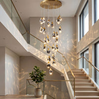 Thumbnail for Luxury irregular raw-cut crystal geode chandelier with natural brass hardware creating dramatic prism lighting in two-story entryway
