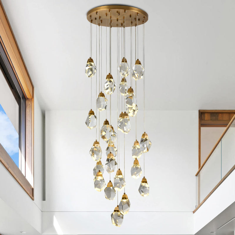 Modern foyer chandelier with brass finish, irregular raw-cut crystal cluster for two-story entryway staircase