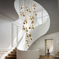 Thumbnail for Real K9 crystal chandelier with irregular raw-cut prisms, natural brass finish for luxury foyer stairwell