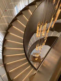 Thumbnail for The Golden Angel's Tear crystal chandelier, with its cascading teardrop design, adds a unique charm to the staircase lighting.UL