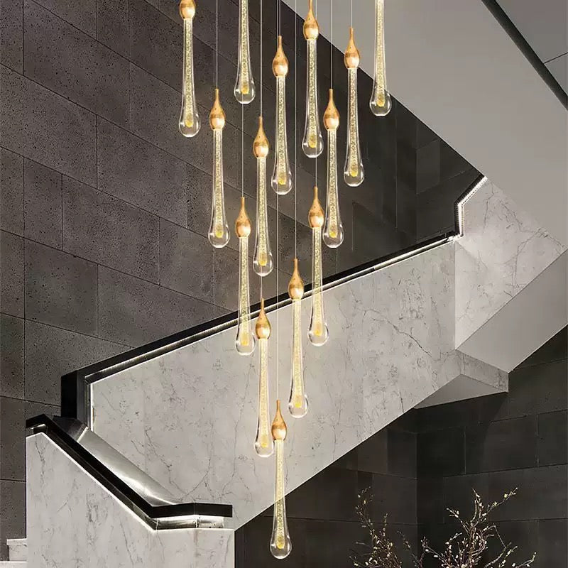 ll foyer high ceiling
Gold angel tears crystal chandelier, cascading teardrop design enhancing staircase foyer entryway modern interior