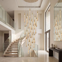 Thumbnail for Luxury gold Seraphim Cascade angel tears crystal chandelier with cascading teardrop pendants illuminating elegant two-story staircase foyer