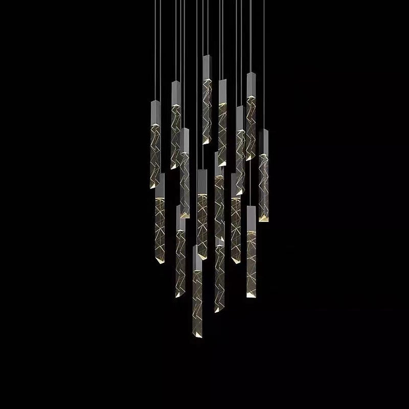 Modern LED linear pendant staircase chandelier with clear crystal elements and a sleek metallic structure, installed in a home staircase setting.