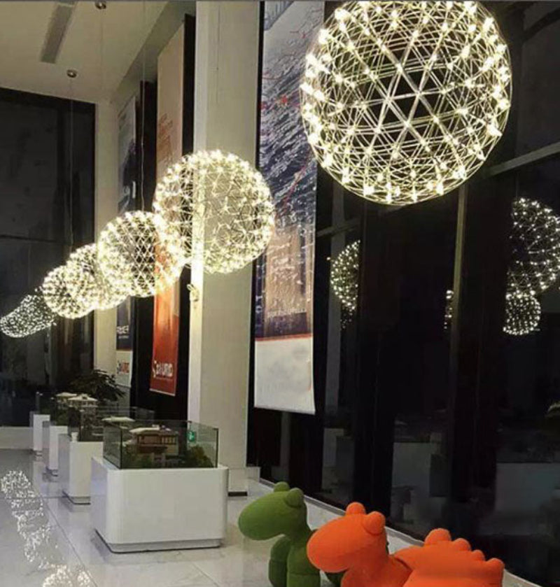 Chrome-plated fireworks-style chandelier with LED starburst dandelion design, suitable for high-ceiling spaces such as foyers, entrances, and commercial areas.